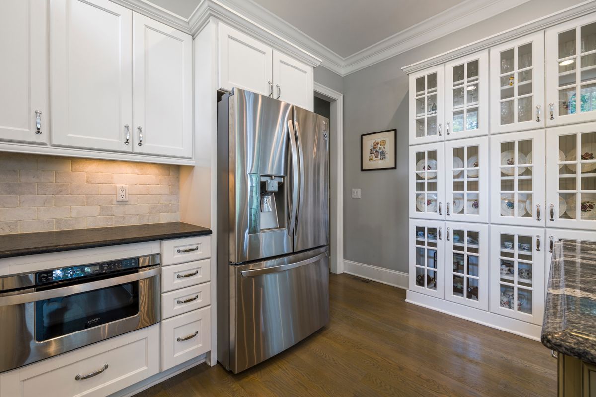Classic white kitchen with glass cabinets